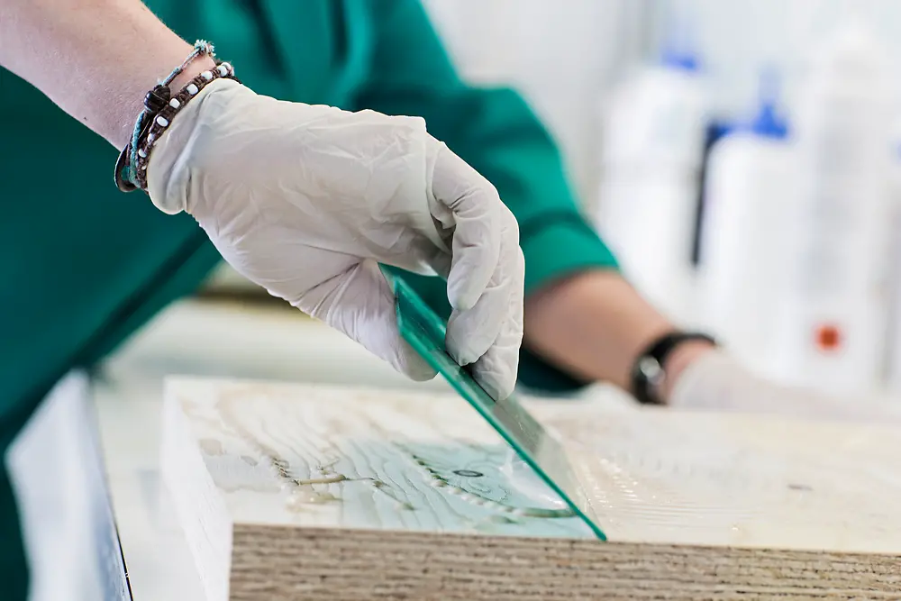 Employee working with mass timber and Henkel adhesives