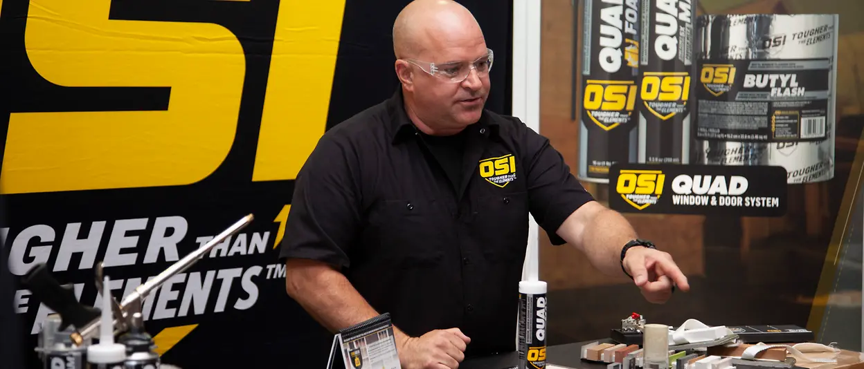 Man demonstrating OSI® QUAD® MAX sealants