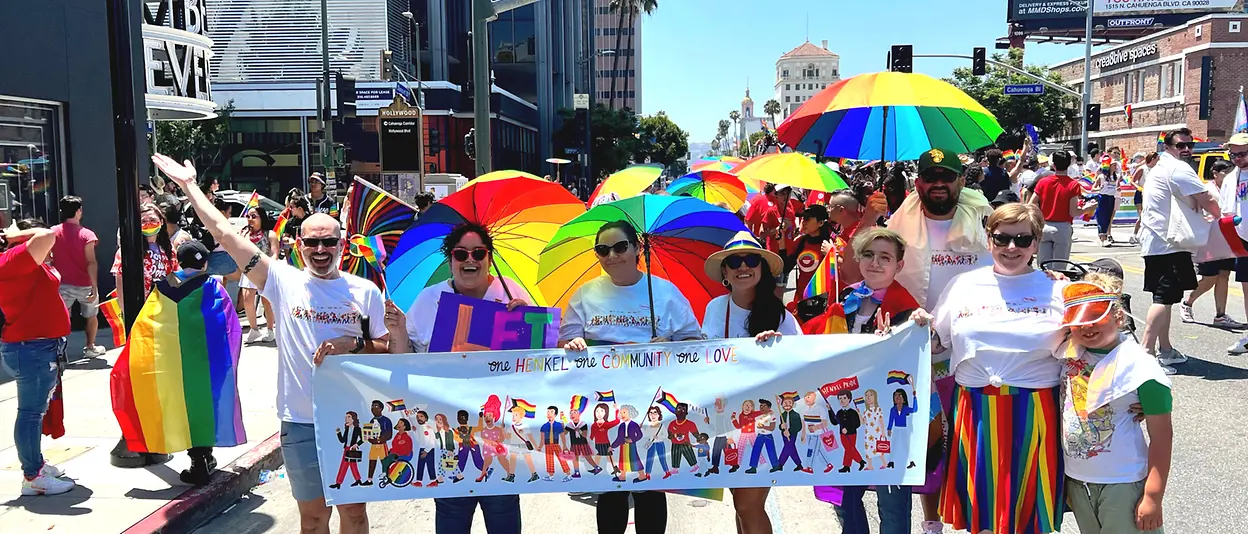 People marching in parade with banner