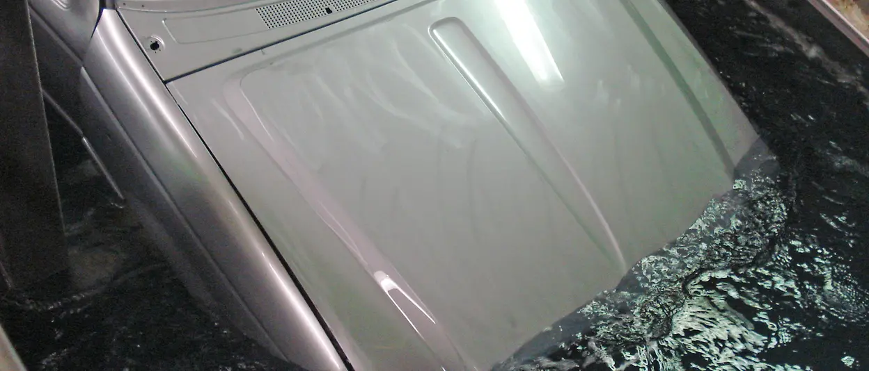 Metal on vehicle being pretreated