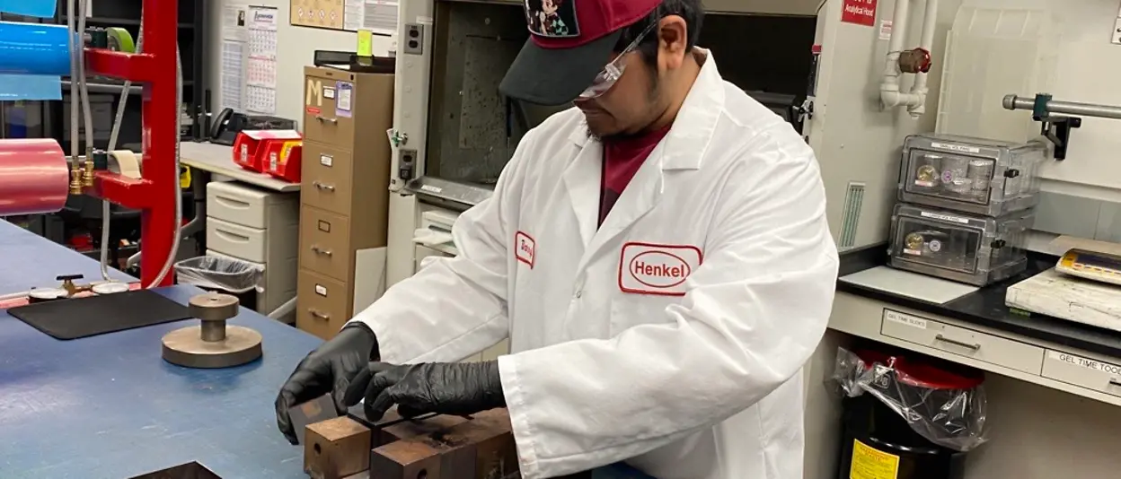 Man in lab coat assembling blocks