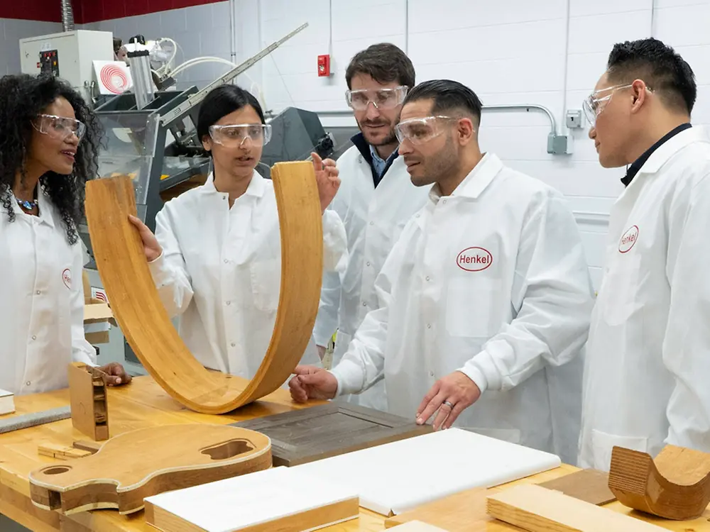 Customers and lab staff discuss new technologies in a laboratory at the Bridgewater Technology Center.