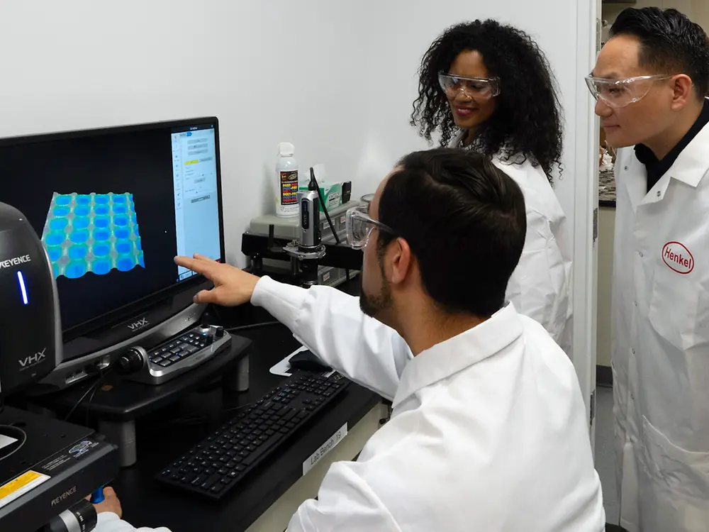 A laboratory employee showing customers his work in an analytical laboratory at Technology Center Bridgewater.