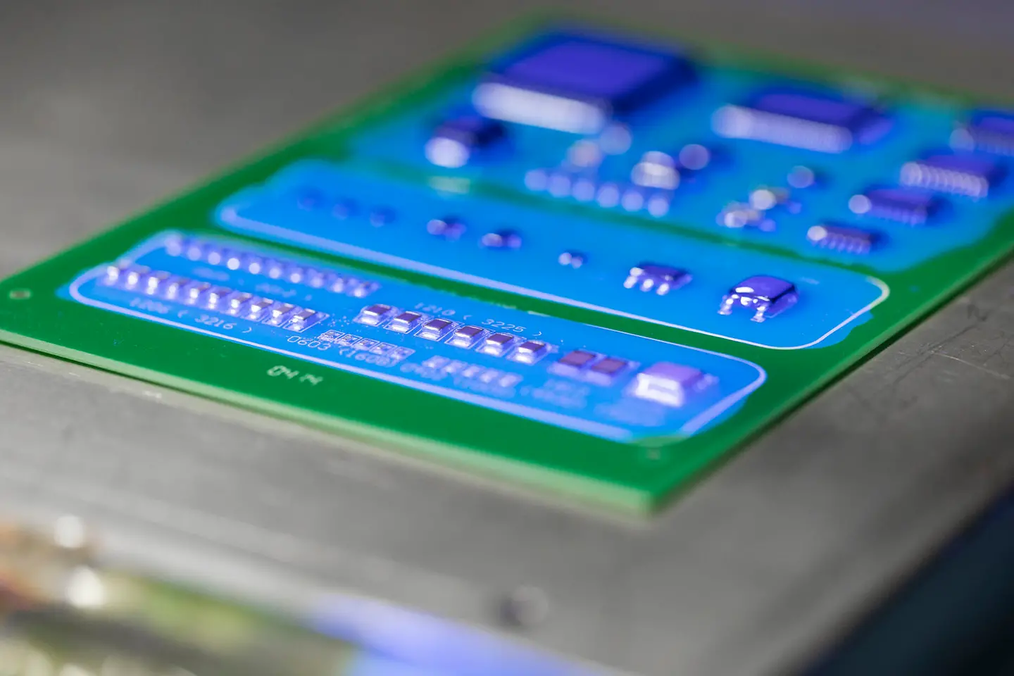 
Conformal coating material under UV light