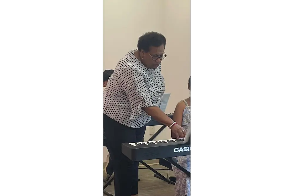 Carita teaches piano lessons