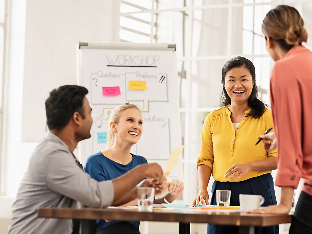 Four co-workers in a brainstorming session.