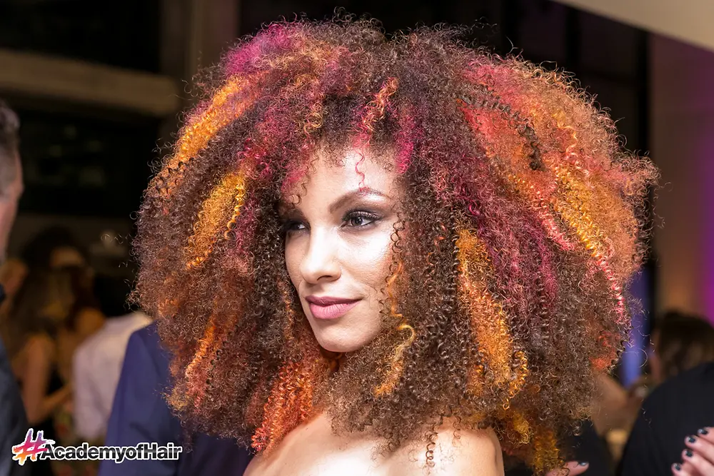 One of the Henkel #AcademyofHair models shows her style on the runway at the opening of the facility on June 14, 2018.